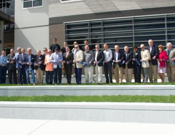 All hands on deck as some 30 key people cut the ribbon on the new COA Dare County Campus.